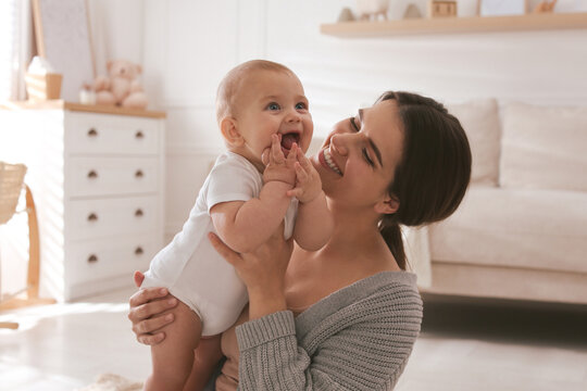 A caregiver holding a newborn baby gently