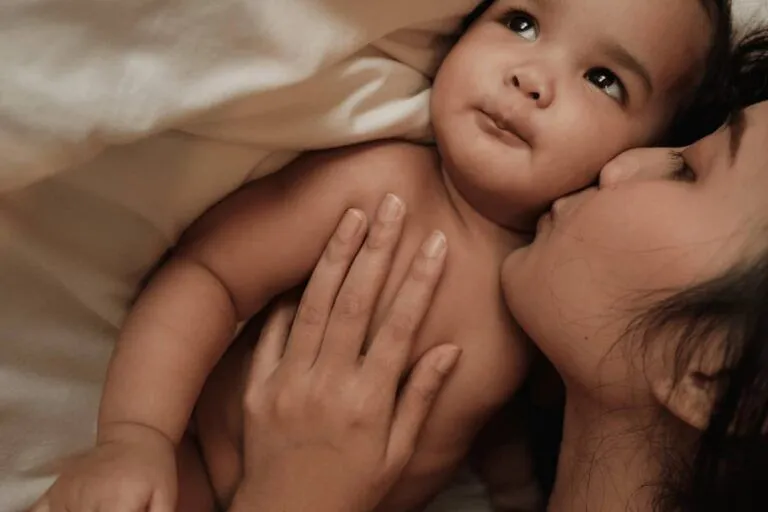 A postpartum therapist consulting with a mother in a luxury home